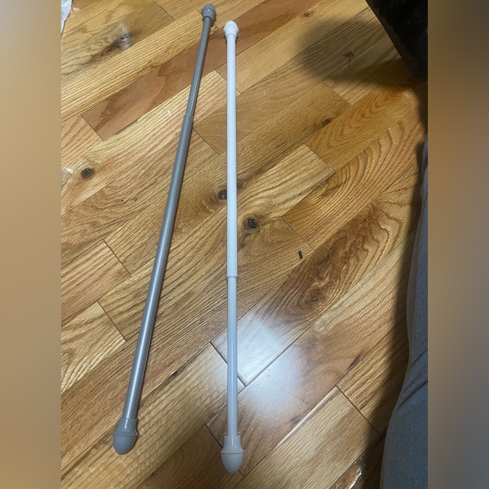 2 adjustable tension curtain rods 18-28”
